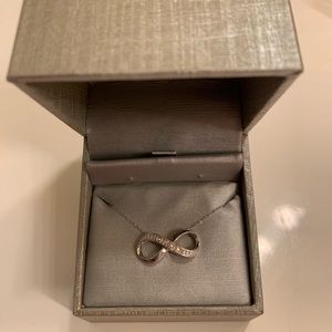 Diamond and white gold infinity necklace